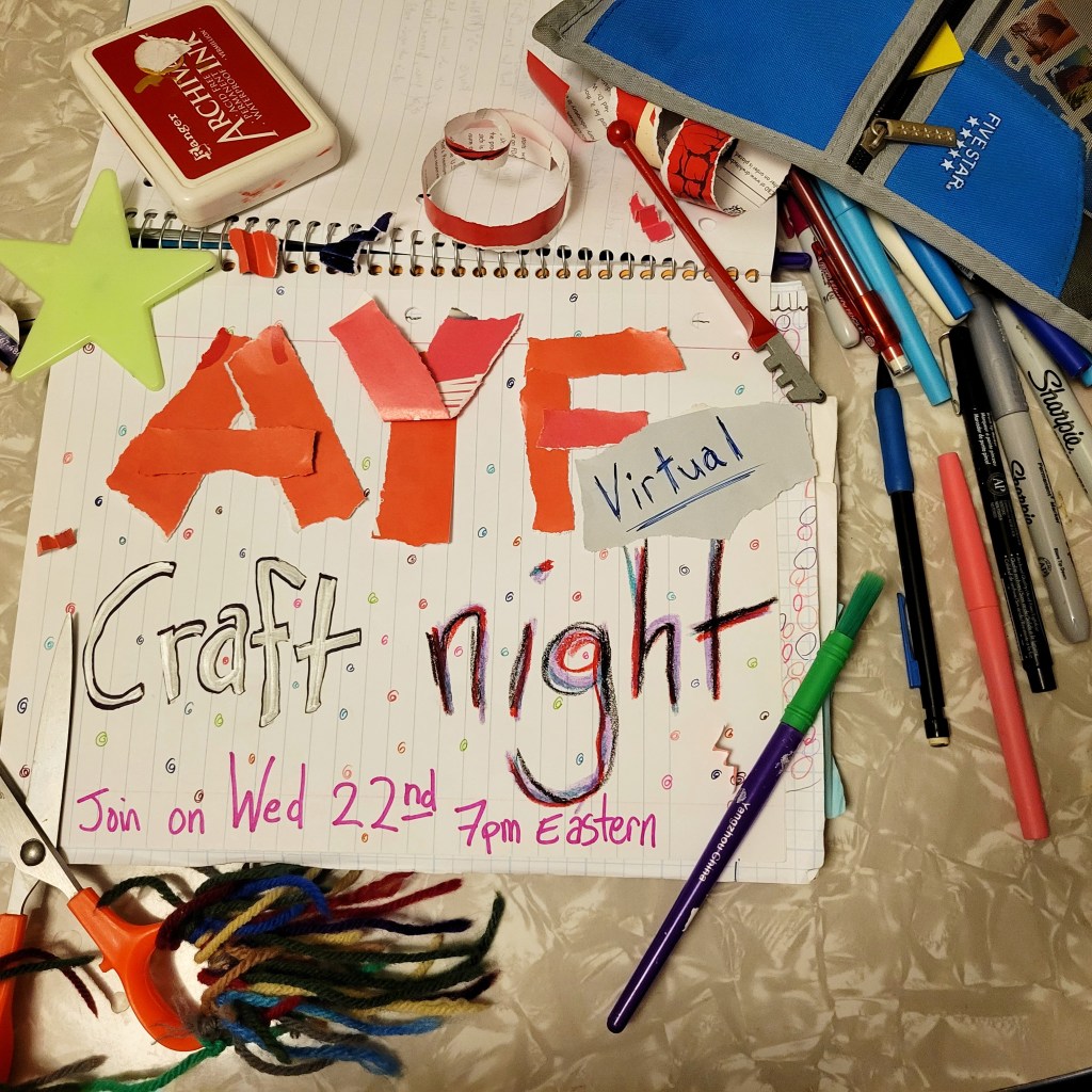 photo notebook opened with text "AYF craft night" and event information made from torn paper, silver marker, and multiple colored markers. Notebook has an open pencil case next to it full of writing tools