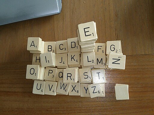 Scrabble tiles stacked in alphabetical order