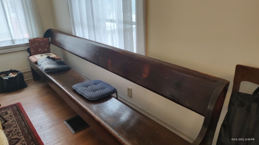 Brown church pew with pillows