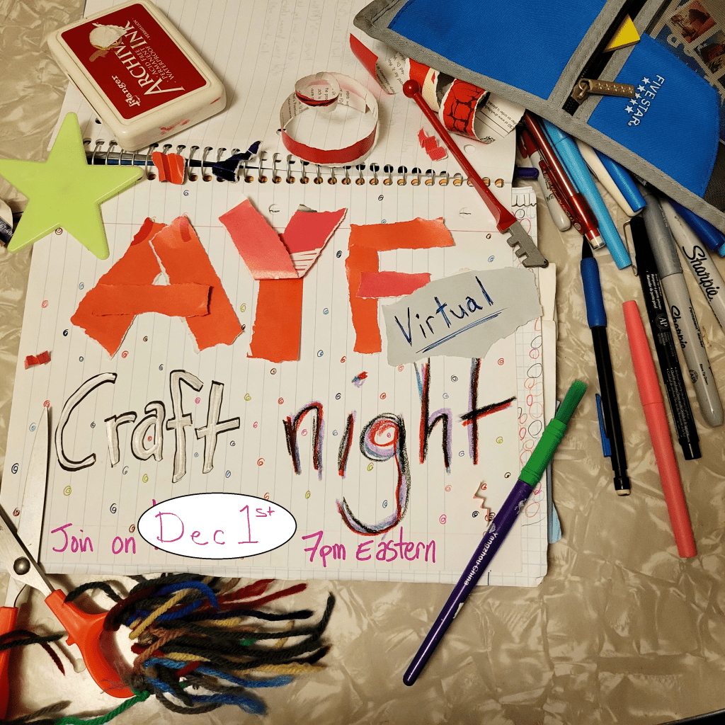 photo notebook opened with text "AYF craft night" and event information made from torn paper, silver marker, and multiple colored markers. Notebook has an open pencil case next to it full of writing tools