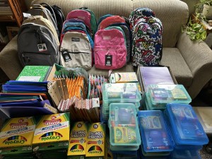 backpacks and school supplies organized by type